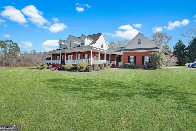 view of front of home featuring covered porch and a front lawn