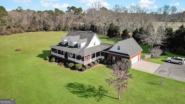 aerial view featuring a wooded view