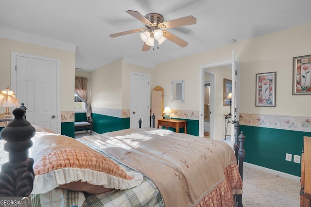 bedroom featuring a ceiling fan and light colored carpet