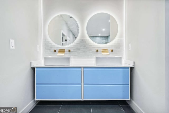 bathroom featuring baseboards, tasteful backsplash, vanity, and tile patterned floors