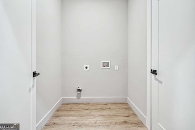 laundry area with laundry area, light wood-style flooring, hookup for a washing machine, and electric dryer hookup