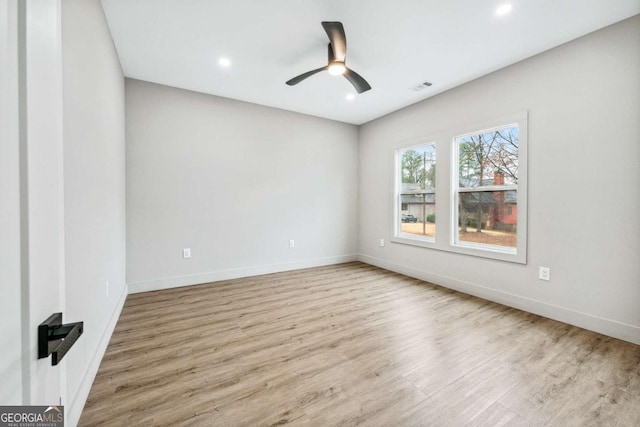 empty room with recessed lighting, visible vents, a ceiling fan, baseboards, and light wood finished floors