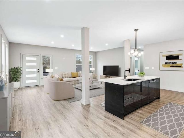 living area featuring light wood finished floors and recessed lighting