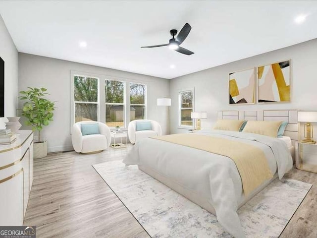 bedroom with light wood finished floors, recessed lighting, a ceiling fan, and baseboards