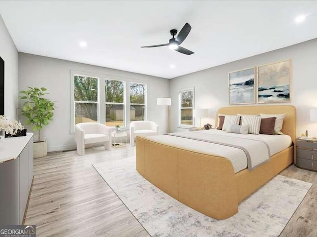 bedroom with ceiling fan, light wood finished floors, and recessed lighting