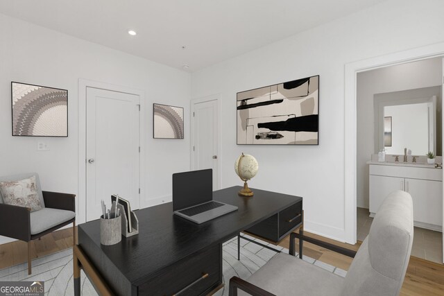 bedroom with light wood-type flooring and recessed lighting
