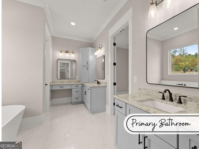 bathroom featuring a freestanding tub, two vanities, a sink, marble finish floor, and crown molding