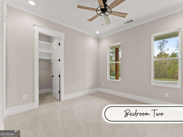 unfurnished bedroom with light carpet, baseboards, visible vents, and recessed lighting