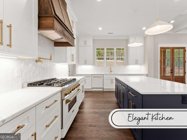 kitchen featuring decorative light fixtures, custom exhaust hood, white cabinetry, a healthy amount of sunlight, and white appliances