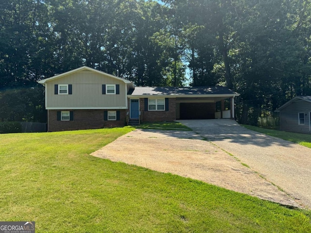 split level home featuring a carport, a front yard, concrete driveway, and brick siding