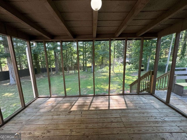 unfurnished sunroom featuring a healthy amount of sunlight