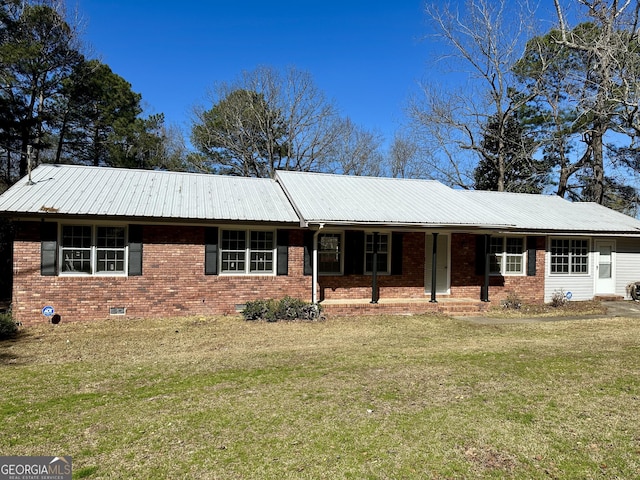 ranch-style home with a front yard, crawl space, brick siding, and metal roof