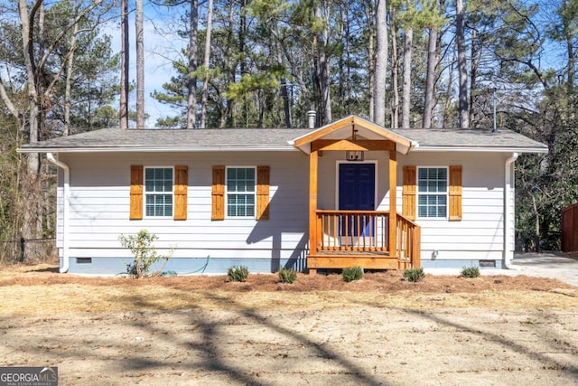 ranch-style home featuring crawl space and fence