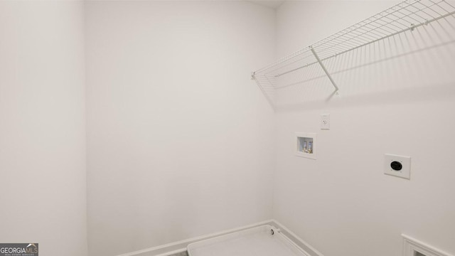 washroom with laundry area, baseboards, washer hookup, and hookup for an electric dryer