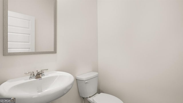 bathroom with a sink and toilet