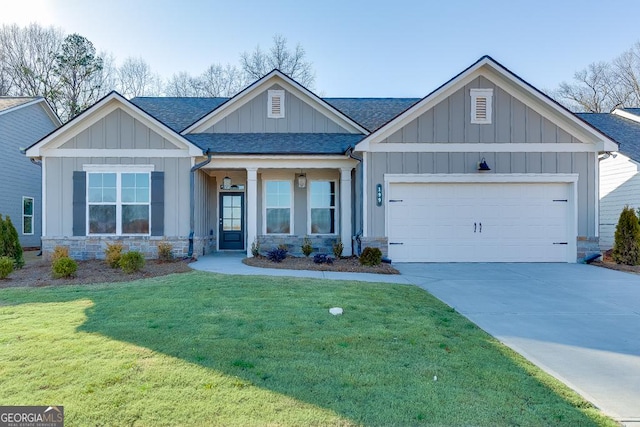 craftsman house with a garage, a front lawn, board and batten siding, and roof with shingles