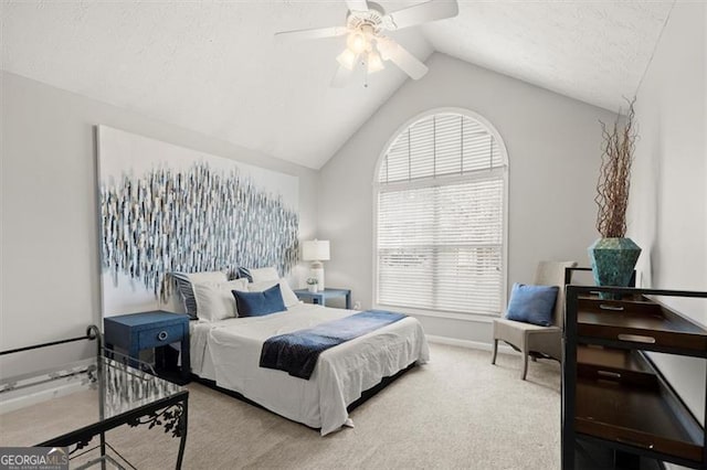 bedroom featuring carpet, lofted ceiling, ceiling fan, a textured ceiling, and baseboards