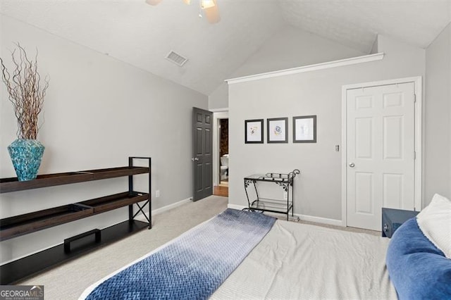 bedroom with baseboards, visible vents, vaulted ceiling, and light colored carpet