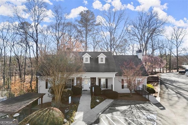 cape cod home with a chimney