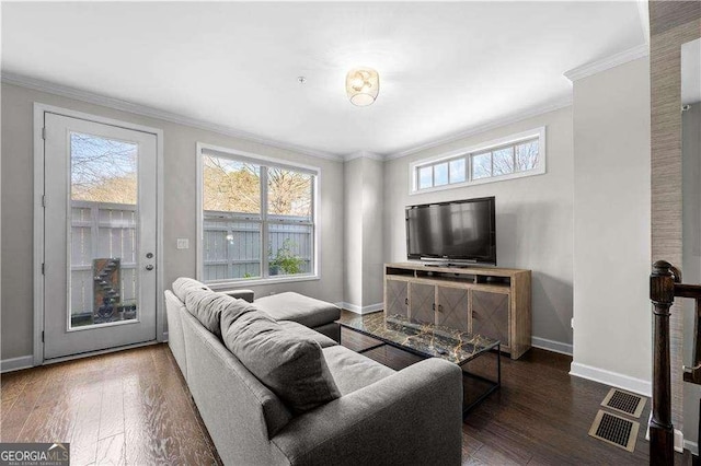 living area with crown molding, dark wood finished floors, and baseboards