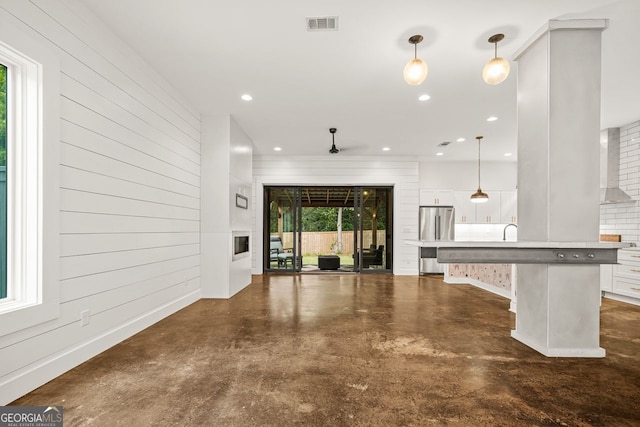 244 Locust St Unit B, Atlanta, GA 30317 - unfurnished living room with finished concrete flooring, recessed lighting, and a sink