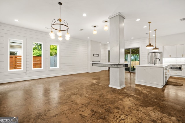 244 Locust St Unit B, Atlanta, GA 30317 - kitchen with concrete flooring, plenty of natural light, freestanding refrigerator, light countertops, and recessed lighting
