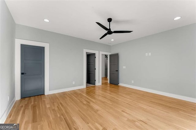 unfurnished bedroom with light wood-style floors, ceiling fan, baseboards, and recessed lighting