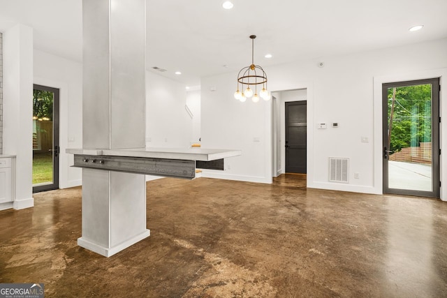 244 Locust St Unit B, Atlanta, GA 30317 - kitchen featuring finished concrete flooring, recessed lighting, baseboards, hanging light fixtures, and a chandelier