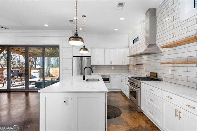 244 Locust St Unit B, Atlanta, GA 30317 - kitchen featuring stainless steel appliances, a sink, wall chimney range hood, tasteful backsplash, and concrete floors
