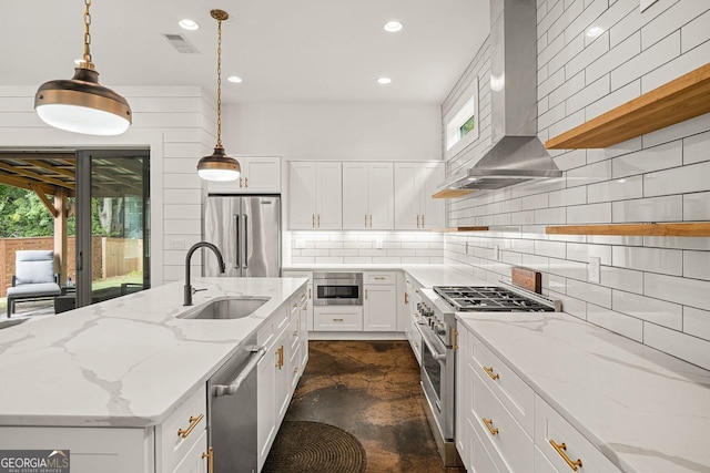 244 Locust St Unit B, Atlanta, GA 30317 - kitchen with premium appliances, wall chimney exhaust hood, a sink, healthy amount of natural light, and recessed lighting