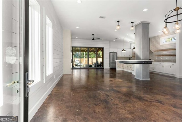 unfurnished living room featuring ceiling fan, concrete floors, visible vents, and recessed lighting