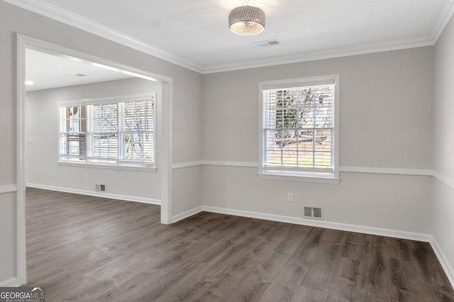 empty room with visible vents and wood finished floors