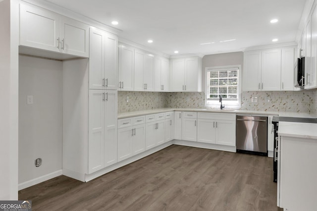 kitchen featuring white cabinetry, dark wood-style flooring, appliances with stainless steel finishes, and a sink