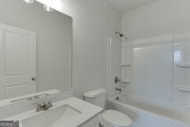 full bathroom with  shower combination, vanity, and toilet