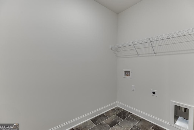 laundry room with hookup for a washing machine, laundry area, electric dryer hookup, and baseboards