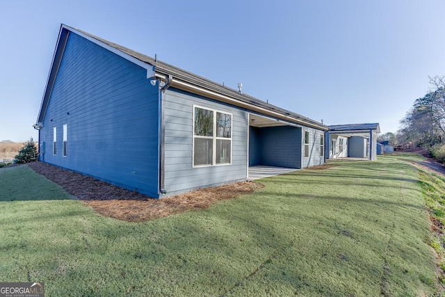 rear view of house with a lawn