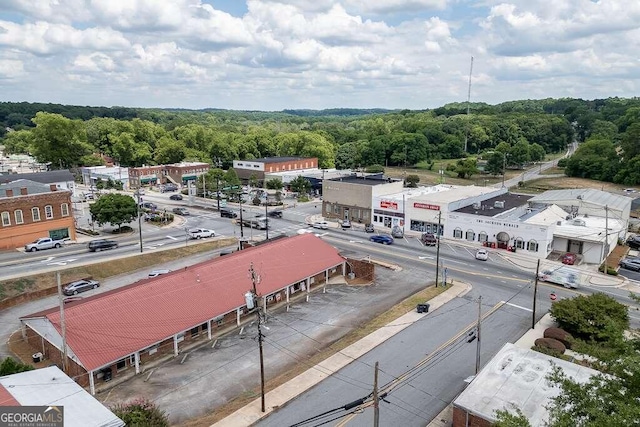 bird's eye view featuring a wooded view