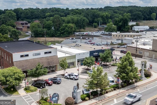 birds eye view of property with a forest view