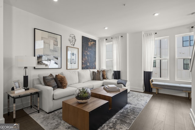 living room with baseboards, a wealth of natural light, light wood-style flooring, and recessed lighting