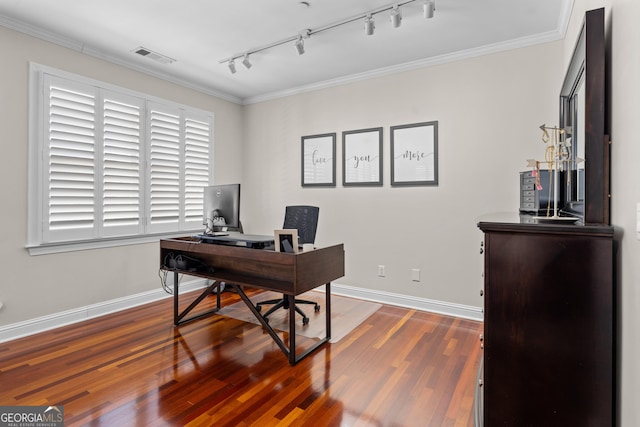 office space featuring wood finished floors, visible vents, and crown molding