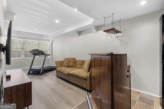 workout area featuring light wood finished floors, baseboards, and recessed lighting