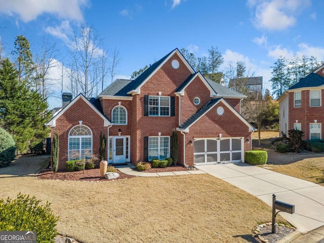 view of front of property with a garage, concrete driveway, brick siding, and a front lawn