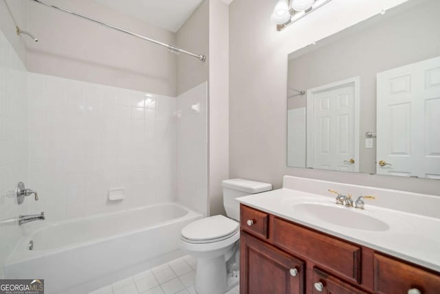 bathroom featuring washtub / shower combination, vanity, toilet, and tile patterned floors