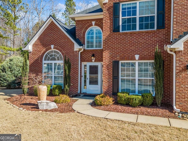 view of front of home with brick siding