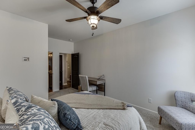 bedroom featuring light carpet, a ceiling fan, and baseboards