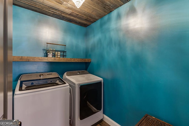 laundry room featuring wooden ceiling, independent washer and dryer, baseboards, and laundry area