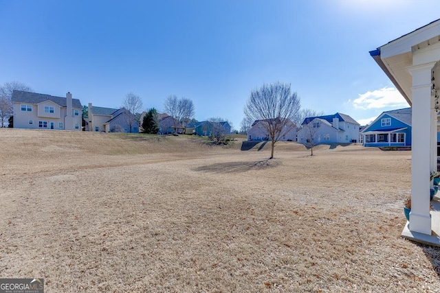 view of yard featuring a residential view