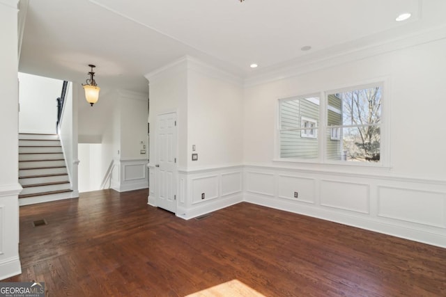 unfurnished living room with crown molding, visible vents, dark wood-style flooring, and recessed lighting