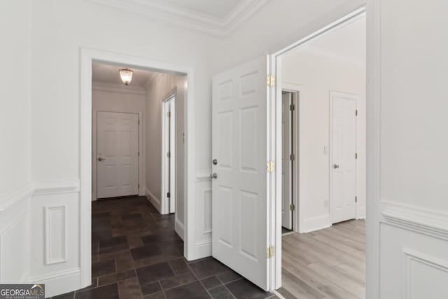 hall featuring dark wood-style flooring and crown molding