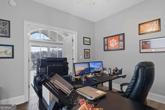 office area featuring baseboards and wood finished floors